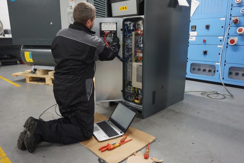 Engineer carrying out task as part of a compressed air service plan