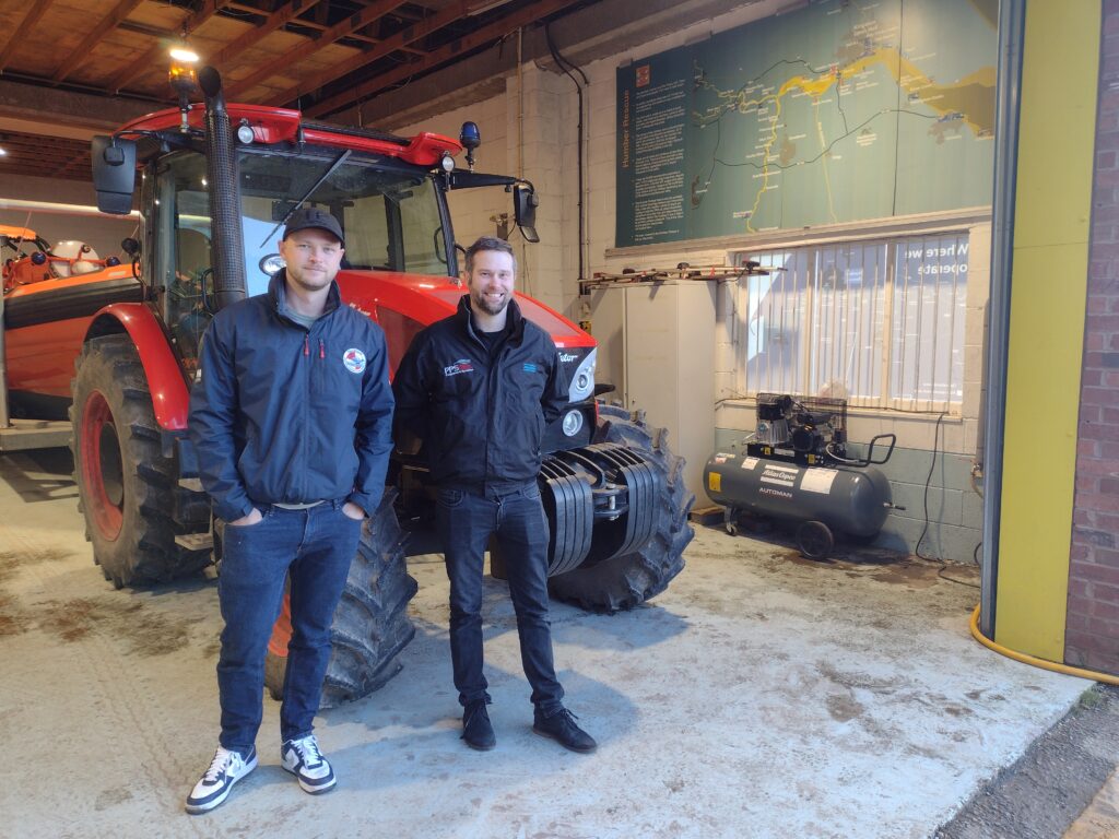 Sam Willis (Humber Rescue) and Nick Forth (Norman Walker) pictured next to the Atlas Copco air compressor and launching tractor.